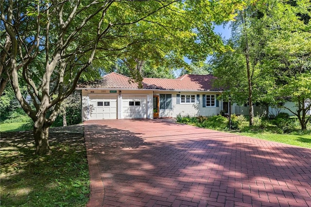 500 Pine Grove Ave, Irondequoit, NY 14617 - ranch-style home with an attached garage, decorative driveway, and a tile roof
