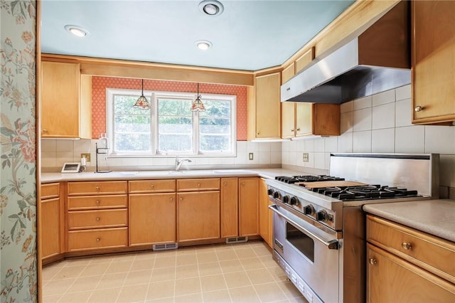 500 Pine Grove Ave, Irondequoit, NY 14617 - kitchen featuring stainless steel stove, wall chimney exhaust hood, wallpapered walls, light countertops, and backsplash