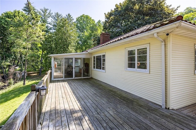 500 Pine Grove Ave, Irondequoit, NY 14617 - wooden deck with a sunroom and a lawn