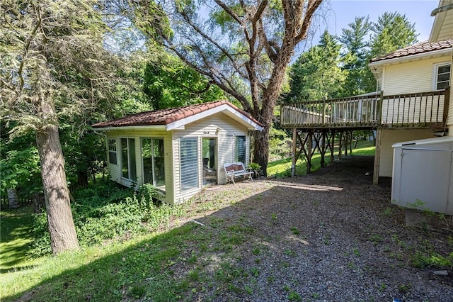 500 Pine Grove Ave, Irondequoit, NY 14617 - view of yard with a deck, dirt driveway, and an outbuilding