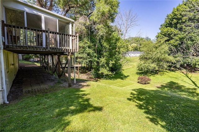 500 Pine Grove Ave, Irondequoit, NY 14617 - view of green lawn featuring a sunroom and a wooden deck