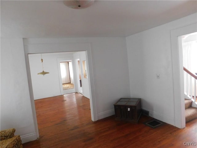 205 Shotwell Park Unit 100, Syracuse, NY 13206 - empty room featuring wood finished floors and stairway