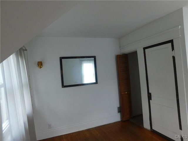 205 Shotwell Park Unit 100, Syracuse, NY 13206 - unfurnished bedroom featuring dark wood-style floors and baseboards