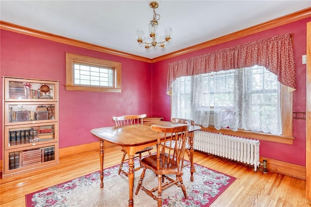 103 Culver Pkwy, Irondequoit, NY 14609 - dining room featuring radiator heating unit, ornamental molding, a chandelier, and wood finished floors