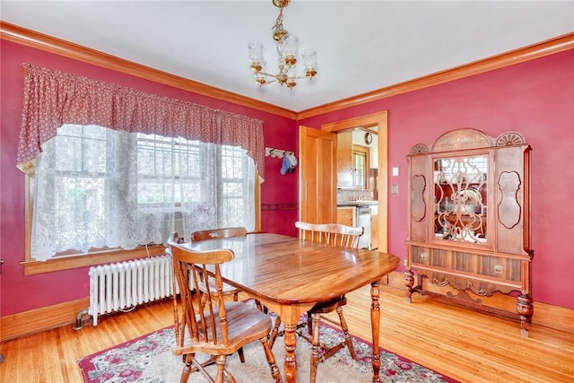103 Culver Pkwy, Irondequoit, NY 14609 - dining space with radiator heating unit, a chandelier, wood finished floors, and crown molding