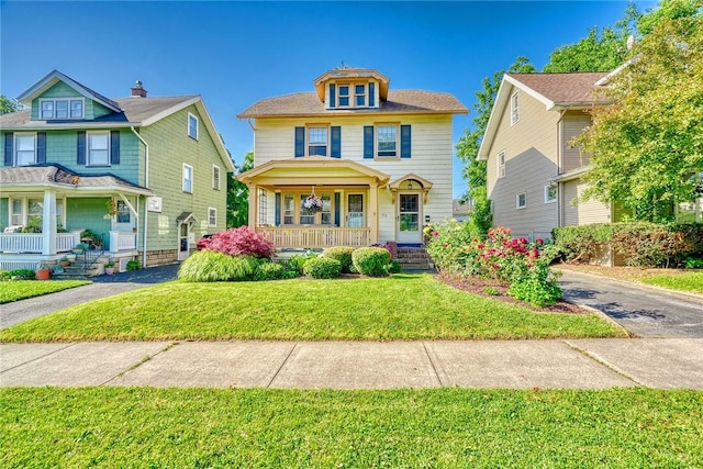 103 Culver Pkwy, Irondequoit, NY 14609 - traditional style home with covered porch, a front lawn, and driveway
