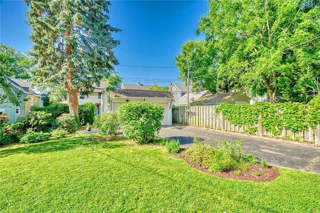 103 Culver Pkwy, Irondequoit, NY 14609 - view of yard with driveway and a garage