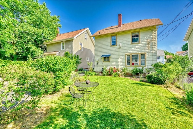 103 Culver Pkwy, Irondequoit, NY 14609 - rear view of house with a chimney