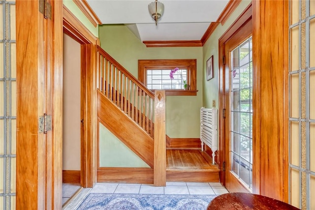 103 Culver Pkwy, Irondequoit, NY 14609 - foyer with tile patterned floors, ornamental molding, and stairway