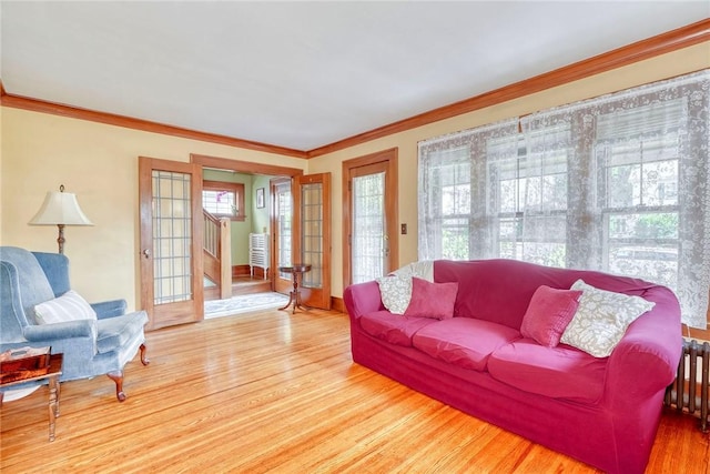 103 Culver Pkwy, Irondequoit, NY 14609 - living area with crown molding, wood finished floors, and stairway