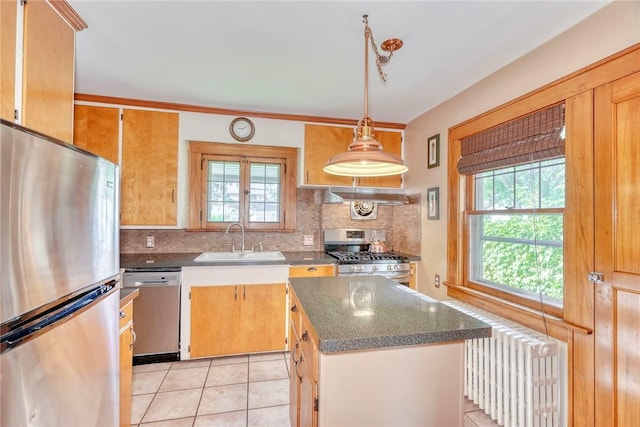 103 Culver Pkwy, Irondequoit, NY 14609 - kitchen with stainless steel appliances, radiator heating unit, under cabinet range hood, and decorative backsplash