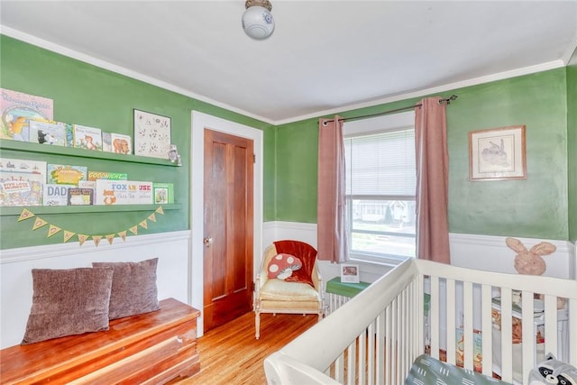 103 Culver Pkwy, Irondequoit, NY 14609 - bedroom with wood finished floors, crown molding, and a wainscoted wall