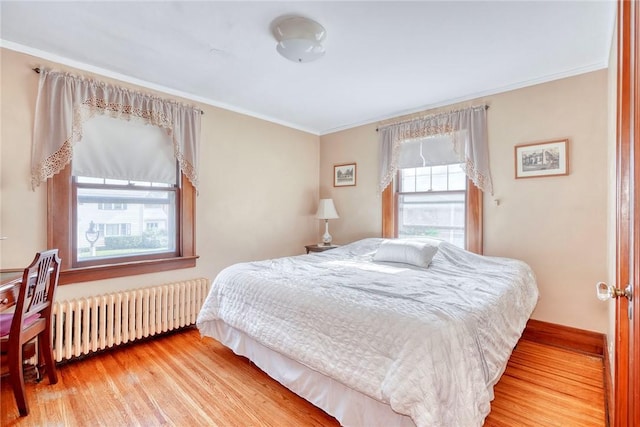 103 Culver Pkwy, Irondequoit, NY 14609 - bedroom with radiator, wood finished floors, and crown molding