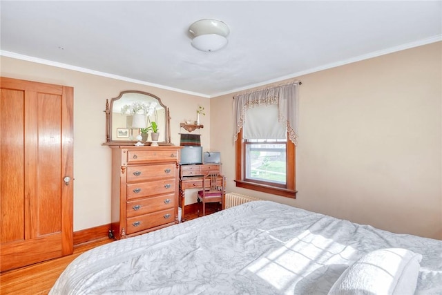 103 Culver Pkwy, Irondequoit, NY 14609 - bedroom with ornamental molding, radiator, and wood finished floors