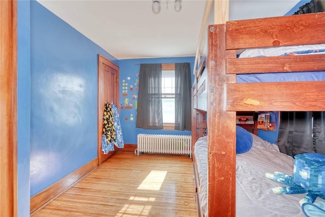 103 Culver Pkwy, Irondequoit, NY 14609 - unfurnished bedroom featuring wood finished floors and radiator heating unit