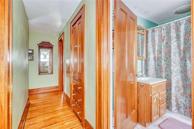 103 Culver Pkwy, Irondequoit, NY 14609 - hallway featuring a sink and light wood-type flooring