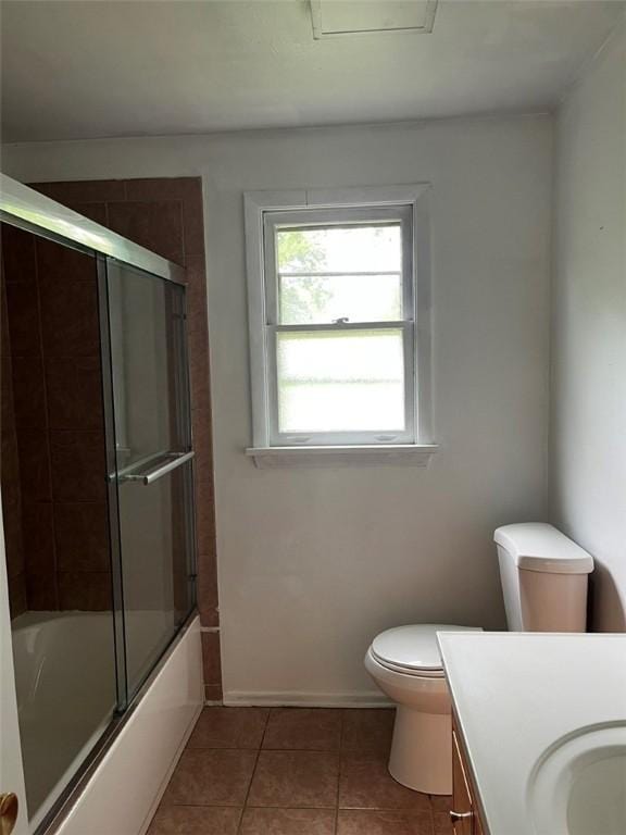 120 Valley St, Rochester, NY 14612 - bathroom featuring vanity, tile patterned floors, and combined bath / shower with glass door