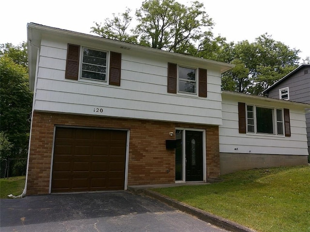 120 Valley St, Rochester, NY 14612 - view of front of home featuring a garage, asphalt driveway, brick siding, and a front yard