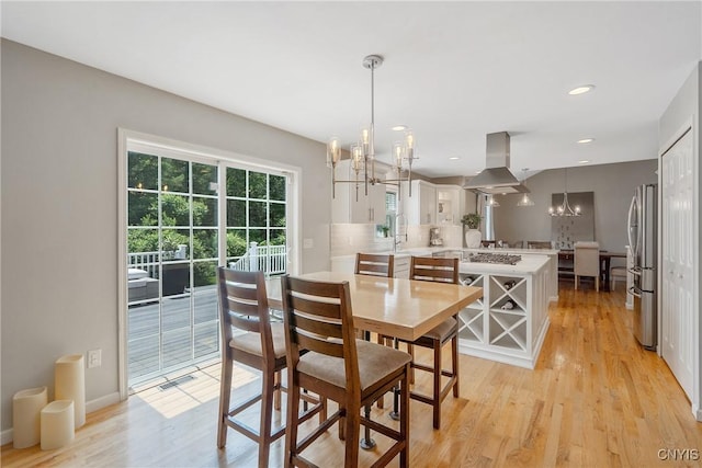 5269 Medasano Cir, Clay, NY 13041 - dining space featuring a chandelier, light wood finished floors, and recessed lighting
