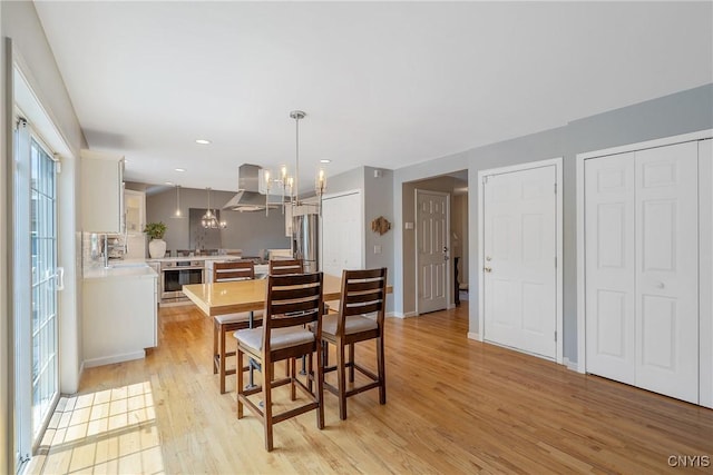 5269 Medasano Cir, Clay, NY 13041 - dining space with light wood-style floors, a chandelier, and recessed lighting