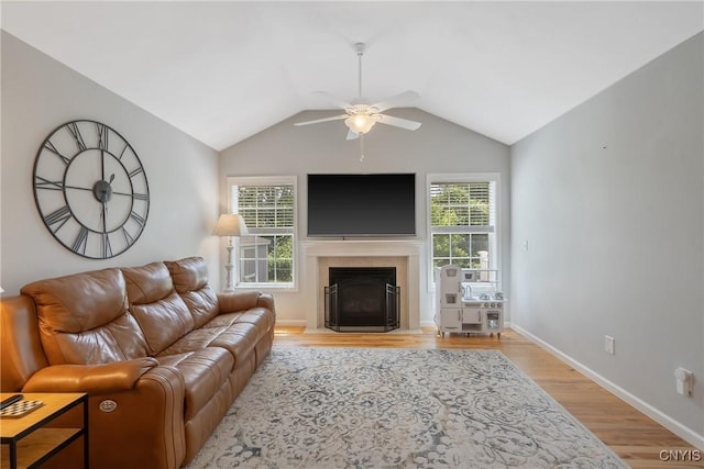 5269 Medasano Cir, Clay, NY 13041 - living room with a ceiling fan, light wood-style floors, a fireplace, and vaulted ceiling