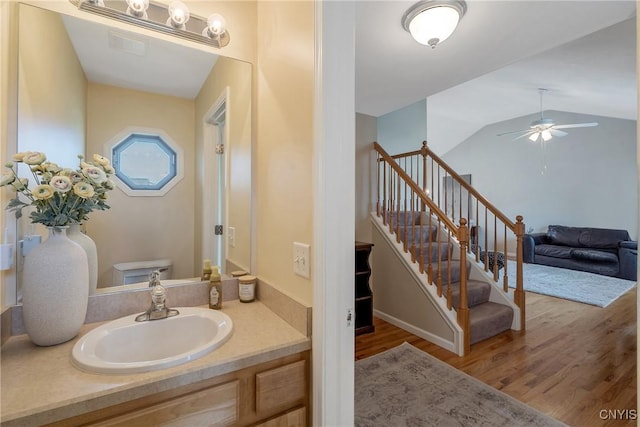 5269 Medasano Cir, Clay, NY 13041 - bathroom with wood finished floors, vanity, a ceiling fan, and vaulted ceiling