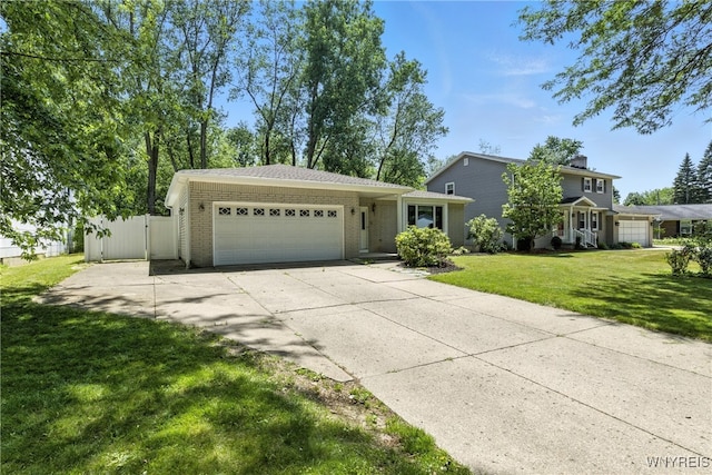 53 Christine Dr, Amherst, NY 14228 - view of front of home featuring a garage, driveway, and brick siding