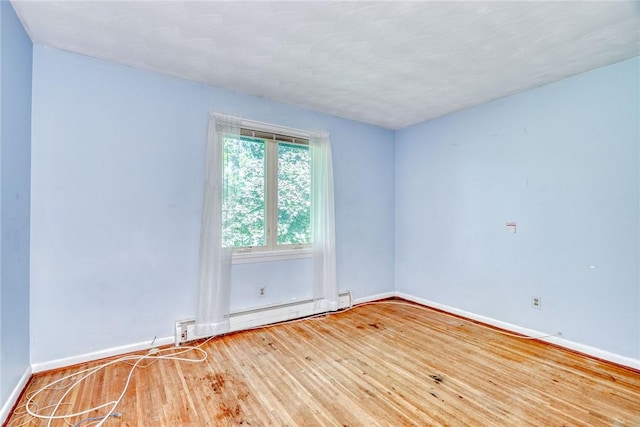 238 Fisher Rd, Chili, NY 14624 - spare room with baseboard heating and wood finished floors