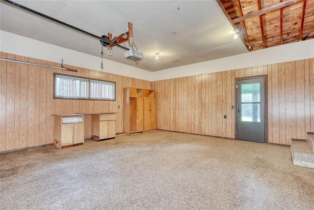 238 Fisher Rd, Chili, NY 14624 - garage featuring wood walls and a garage door opener