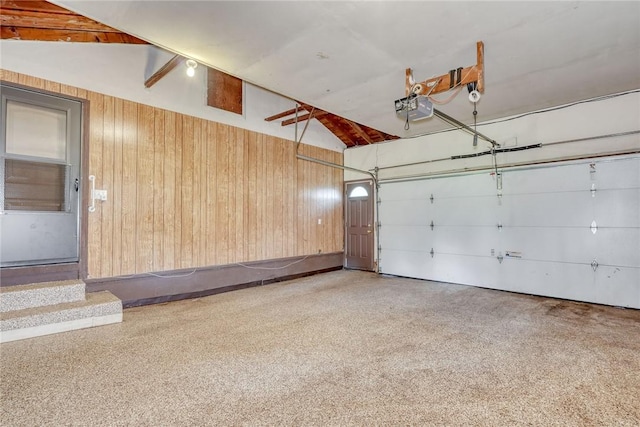 238 Fisher Rd, Chili, NY 14624 - garage featuring a garage door opener and wood walls