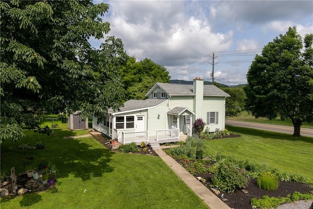 514 Maple St, Big Flats, NY 14814 - view of front of house with a front yard, a chimney, and roof with shingles