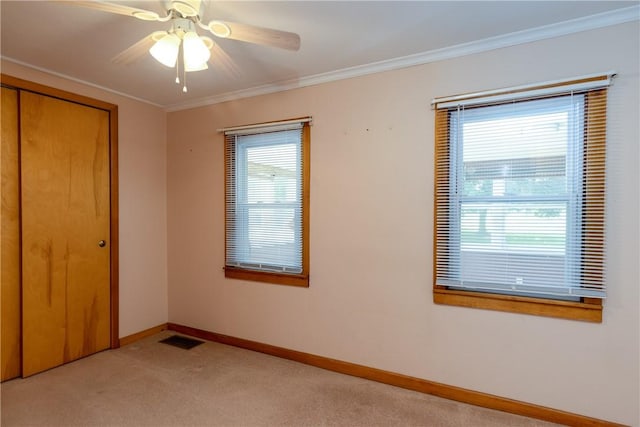 514 Maple St, Big Flats, NY 14814 - unfurnished bedroom with a closet, multiple windows, light carpet, ornamental molding, and ceiling fan