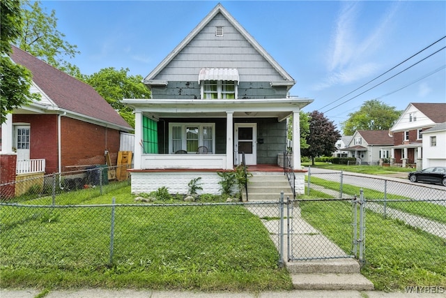 2224 Walnut Ave, Niagara Falls, NY 14301 - shotgun-style home featuring covered porch, a gate, and a fenced front yard