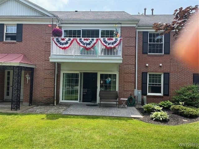3 Homer Ln Unit B, Amherst, NY 14221 - rear view of property featuring brick siding, a yard, a patio, and a balcony