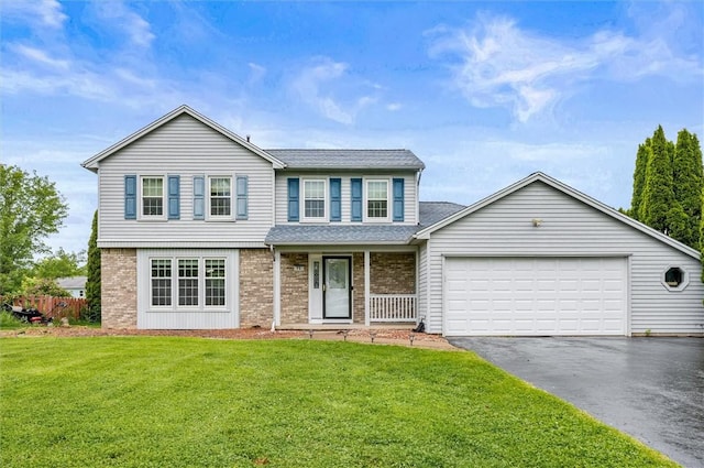 73 Hazel Bark Run, Gates, NY 14606 - view of front of property featuring asphalt driveway, brick siding, a garage, and a front yard