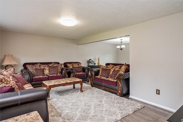 73 Hazel Bark Run, Gates, NY 14606 - living room featuring wood finished floors and a chandelier