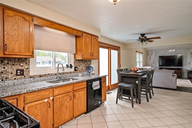 73 Hazel Bark Run, Gates, NY 14606 - kitchen with black appliances, ceiling fan, decorative backsplash, open floor plan, and brown cabinetry