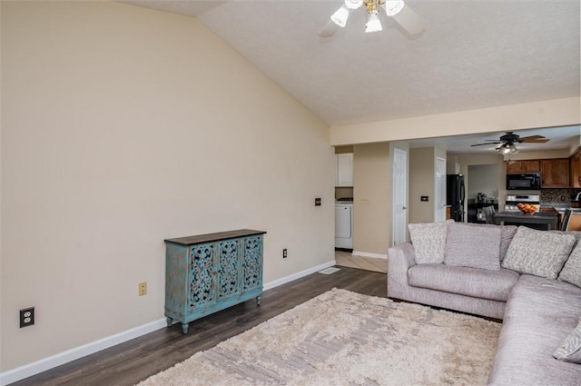 73 Hazel Bark Run, Gates, NY 14606 - living area with ceiling fan, wood finished floors, vaulted ceiling, and washer / dryer