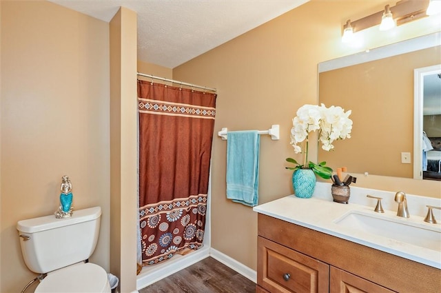 73 Hazel Bark Run, Gates, NY 14606 - ensuite bathroom with vanity, wood finished floors, and curtained shower
