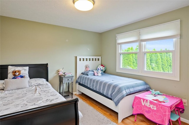 73 Hazel Bark Run, Gates, NY 14606 - bedroom featuring light wood-type flooring and baseboards
