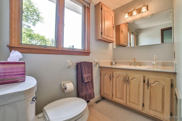 79 Pin Oak Cir, Grand Island, NY 14072 - half bathroom with healthy amount of natural light, vanity, and tile patterned flooring