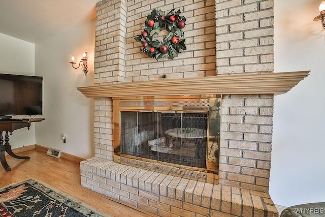 79 Pin Oak Cir, Grand Island, NY 14072 - detailed view of a brick fireplace and wood finished floors