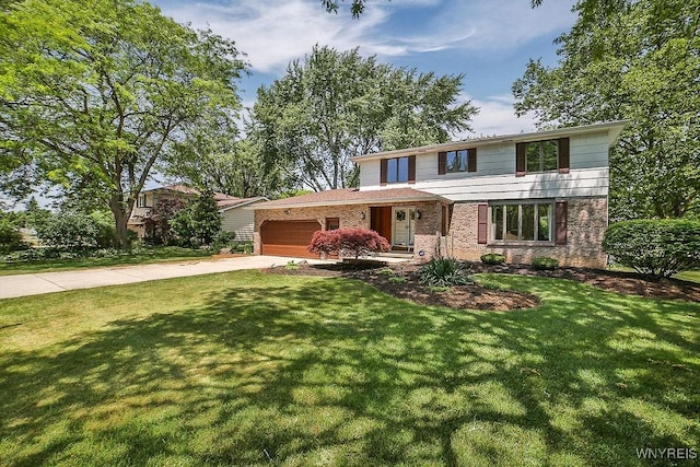 79 Pin Oak Cir, Grand Island, NY 14072 - traditional-style home with a garage, driveway, a front lawn, and brick siding
