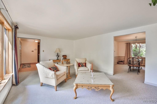 79 Pin Oak Cir, Grand Island, NY 14072 - carpeted living area featuring a chandelier