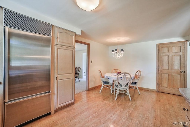 79 Pin Oak Cir, Grand Island, NY 14072 - dining room with a chandelier and light wood-style flooring