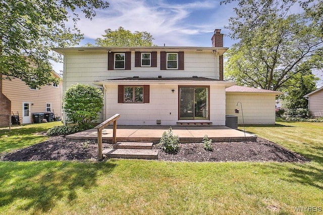 79 Pin Oak Cir, Grand Island, NY 14072 - rear view of house featuring a patio area, a chimney, and a lawn