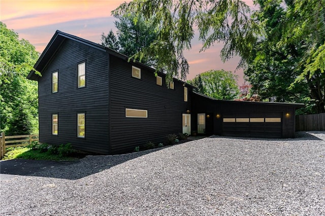 2465 Turk Hill Rd, Perinton, NY 14564 - view of front of property with an attached garage and gravel driveway