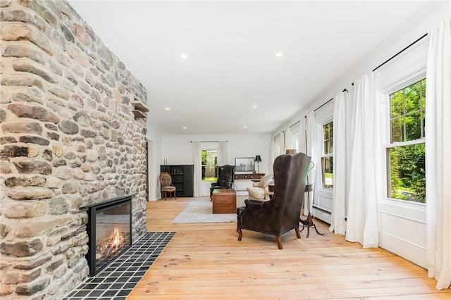2465 Turk Hill Rd, Perinton, NY 14564 - living room featuring a fireplace, light wood-style flooring, and recessed lighting