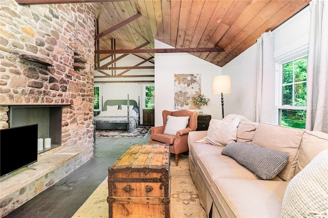 2465 Turk Hill Rd, Perinton, NY 14564 - living area with healthy amount of natural light, lofted ceiling, wooden ceiling, wood finished floors, and a stone fireplace