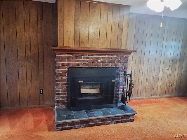 15 Beaver St, Manheim, NY 13329 - detailed view of carpet flooring, wood walls, a brick fireplace, and a ceiling fan